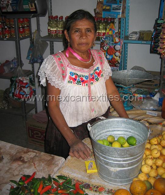 oapan_nahuatl46.JPG - Photo of woman in a store wearing a traditional costume in 2005.